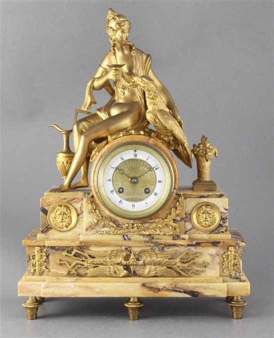 A 19th century French ormolu mounted Sienna marble mantel clock, height 17.75in.